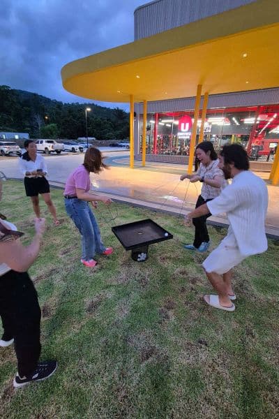 Group playing game outside shopping center