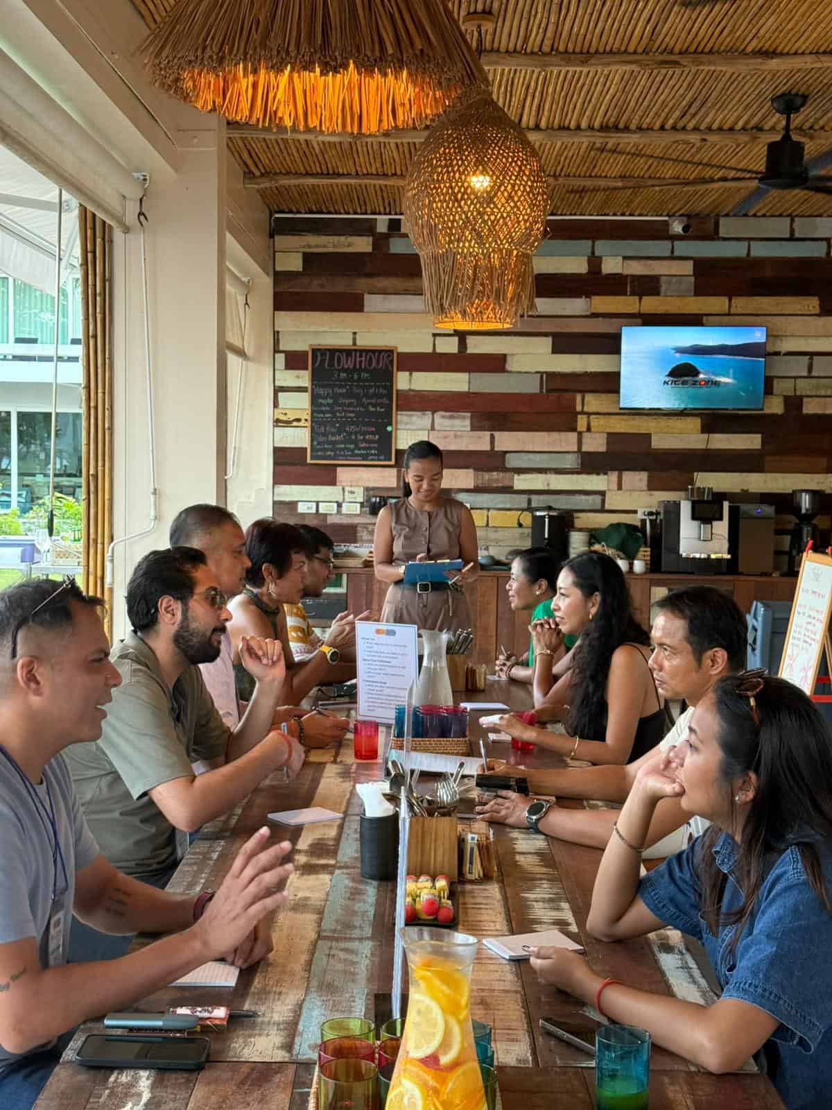 People engaged in a meeting at a rustic cafe.