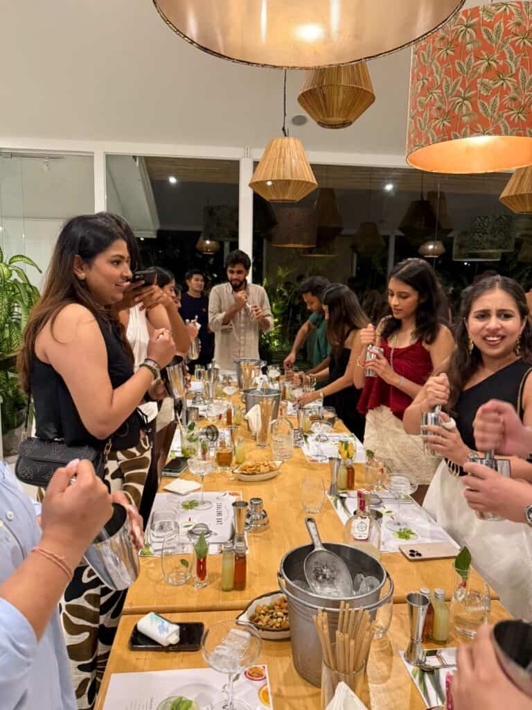 People enjoying a cocktail-making workshop.